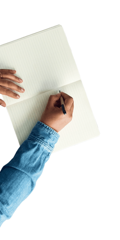 Hands working on notebook